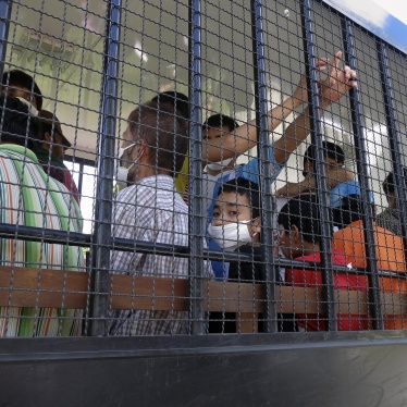 Suspected Uyghurs are transported back to a detention facility in the town of Songkhla in southern Thailand, March 26, 2014.